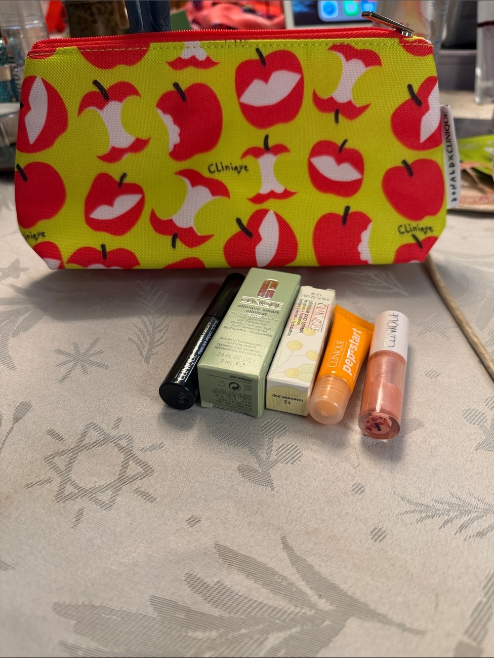 Clinique Yellow Cosmetic Pouch with Red Apple Print and Lip Balms